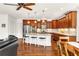 Beautiful kitchen with granite countertops, cherry cabinets, and a breakfast bar with stools at 7125 Heard Rd, Cumming, GA 30041