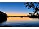 Picturesque lakeside sunset with colorful sky, perfect to relax and enjoy nature's beauty at 7125 Heard Rd, Cumming, GA 30041