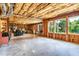 Spacious unfinished basement with exposed framing, concrete floor, and large windows providing natural light at 7125 Heard Rd, Cumming, GA 30041
