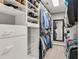 Spacious walk-in closet with custom shelving and ample storage for clothes and shoes at 7125 Heard Rd, Cumming, GA 30041