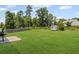Large backyard with green grass and a storage shed at 8553 Braylen Manor Dr, Douglasville, GA 30134
