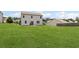 Expansive backyard with ample green space and patio area at 8553 Braylen Manor Dr, Douglasville, GA 30134