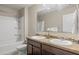 Bathroom featuring double sinks, a shower/tub combo, and decorative accents at 8553 Braylen Manor Dr, Douglasville, GA 30134
