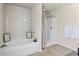 Bright bathroom featuring bathtub and shower combination at 8553 Braylen Manor Dr, Douglasville, GA 30134