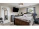 Cozy bedroom with a ceiling fan and a TV mounted on the wall at 8553 Braylen Manor Dr, Douglasville, GA 30134