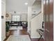 View of entryway, hardwood floors, leading to the living room with a fireplace at 8553 Braylen Manor Dr, Douglasville, GA 30134