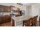 Modern kitchen featuring granite countertops, stainless steel appliances, and a breakfast bar with seating at 8553 Braylen Manor Dr, Douglasville, GA 30134