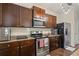 Well-equipped kitchen with stainless steel appliances, granite countertops, and ample cabinet space at 8553 Braylen Manor Dr, Douglasville, GA 30134