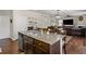Open-concept living space with hardwood floors, dining area, and cozy living room with a fireplace at 8553 Braylen Manor Dr, Douglasville, GA 30134