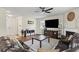 Spacious living room with dark wood floors, fireplace, and ample natural light at 8553 Braylen Manor Dr, Douglasville, GA 30134