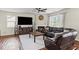 Cozy living room showcasing a fireplace, dark wood flooring, and comfortable seating at 8553 Braylen Manor Dr, Douglasville, GA 30134