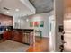 Modern kitchen with stainless steel appliances, granite countertops, and dark backsplash, with hardwood floors at 860 Peachtree Ne St # 2001, Atlanta, GA 30308