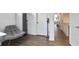 Hallway featuring a seating area, closet, and modern flooring, leading to other rooms at 200 Chestnut Cir, Atlanta, GA 30342