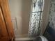 Bathroom featuring a tub with a shower curtain and white wall surround at 245 Jesse Mccollum Dr, Canton, GA 30114