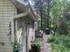 Exterior view of the home with siding, gutters, and a wooded lot at 245 Jesse Mccollum Dr, Canton, GA 30114