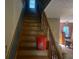 Wooden staircase leading to the upper level of the house at 245 Jesse Mccollum Dr, Canton, GA 30114