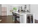 Modern white kitchen with a large island, stainless steel appliances, and ample cabinet space at 5070 Hensley Dr, Atlanta, GA 30338