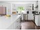 Kitchen with large island, seating, open shelving, and updated appliances at 5070 Hensley Dr, Atlanta, GA 30338