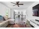Bright living room with open view to kitchen with island and bar stool seating at 5070 Hensley Dr, Atlanta, GA 30338