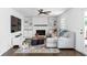 Cozy living room with a brick fireplace, built-in shelving, and a comfortable seating area at 5070 Hensley Dr, Atlanta, GA 30338