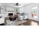 Bright living room with fireplace, open to deck, and neutral, comfortable seating at 5070 Hensley Dr, Atlanta, GA 30338