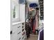 Organized walk-in closet featuring built-in shelving, drawers, and hanging rods at 5070 Hensley Dr, Atlanta, GA 30338