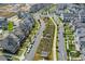 Aerial view showcasing a Primary-planned community with a community garden and tree-lined streets at 579 Brashy St, Woodstock, GA 30188