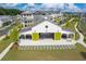 Aerial view of community barn with green doors and outdoor seating, perfect for social gatherings at 579 Brashy St, Woodstock, GA 30188