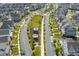 Aerial view of a Primary-planned community with tree-lined streets and a central playground area at 579 Brashy St, Woodstock, GA 30188