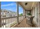 Balcony with a seating area overlooking the neighborhood and blue skies at 579 Brashy St, Woodstock, GA 30188