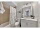 Bathroom featuring a shower-tub combination, and a modern vanity with sleek fixtures at 579 Brashy St, Woodstock, GA 30188