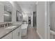 Luxury bathroom with a glass enclosed shower, soaker tub, and double sinks at 579 Brashy St, Woodstock, GA 30188