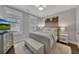 Comfortable bedroom with plantation shutters, soft decor, a plush rug and neutral color palette at 579 Brashy St, Woodstock, GA 30188