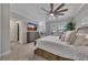 Comfortable bedroom with large bed, tv, and nice windows and fixtures at 579 Brashy St, Woodstock, GA 30188
