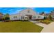 Charming community barn with well-manicured lawn, walkway, and inviting entrance for community gatherings at 579 Brashy St, Woodstock, GA 30188