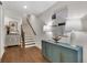 Foyer featuring hardwood floors, an attractive console table with lamps, and an adjacent staircase at 579 Brashy St, Woodstock, GA 30188