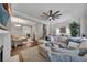 A spacious living room features hardwood floors and a cozy sectional sofa at 579 Brashy St, Woodstock, GA 30188