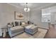 Comfortable living room with a large sectional sofa and modern decor at 579 Brashy St, Woodstock, GA 30188