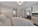 Comfortable main bedroom with a neutral color palette, sliding doors, and access to an ensuite bath at 579 Brashy St, Woodstock, GA 30188