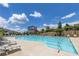 Inviting community swimming pool surrounded by lounge chairs and lush landscaping at 579 Brashy St, Woodstock, GA 30188