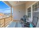 Inviting porch with comfortable chairs, a patterned rug, and outdoor view at 579 Brashy St, Woodstock, GA 30188