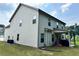 Home back exterior featuring a covered patio with siding and well kept lawn at 7487 Rudder Cir, Fairburn, GA 30213