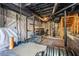 Unfinished basement with gym equipment, exposed ceiling, and concrete floors at 285 Jade Cove Dr, Roswell, GA 30075