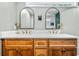 Bathroom featuring double vanity with modern fixtures, and a shower in the background at 285 Jade Cove Dr, Roswell, GA 30075