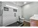 Modern bathroom featuring white subway tiles, frameless glass shower, and stylish fixtures at 285 Jade Cove Dr, Roswell, GA 30075