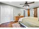 Cozy bedroom featuring a ceiling fan, and large closet with sliding barn door at 285 Jade Cove Dr, Roswell, GA 30075