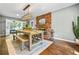 Elegant dining room boasting a fireplace, lots of seating, and hardwood floors at 285 Jade Cove Dr, Roswell, GA 30075