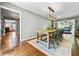 Bright dining room featuring hardwood floors, a wooden table, and an elegant chandelier at 285 Jade Cove Dr, Roswell, GA 30075