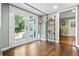 Bright entry with a glass door offering natural light, hardwood floors, and view to the outside at 285 Jade Cove Dr, Roswell, GA 30075