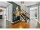 Open foyer featuring gleaming hardwood floors, stylish accents, and staircase at 285 Jade Cove Dr, Roswell, GA 30075